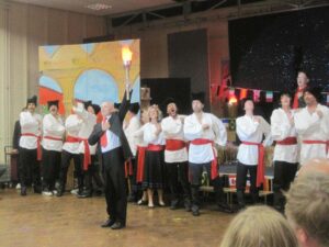 After Vladimir Putin (host of next winter Olympics) receives the flame, the Russian anthem!