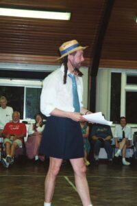 Tim awarding his quiz prize. Do you think he waxes his legs?