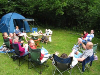 A campsite aperitif as the expensive barbeques heat up in the background