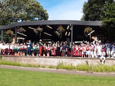 All on stage after the final mini procession round the gardens, ably led by Will and BB