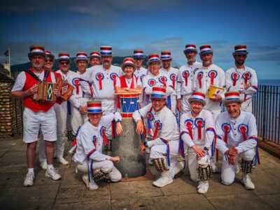 Sidmouth 2023 - Roy, Karen, Jerry, Alun, Lee, Jen, Robert, Paul, Rhys, John, Jameson, Will (kneeling) Ben, Charles, Tom, Malcolm (+ not pictured - Jane, Mark)